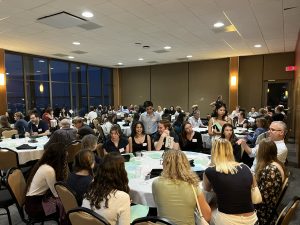 First-Year L&S Honors students participate in the annual first-year dinner by moving through tables to connect with faculty of interest.