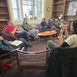Professor Harry Brighouse (left) and Dan Kapust chat with a host of Honors students at the Wednesday @ Washburn event.