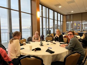 A table with smiling students